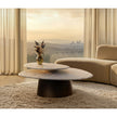 Move Coffee Table by Draenert with rotating natural stone tops and a conical metal base.