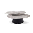 Move Coffee Table by Draenert with rotating natural stone tops and a conical metal base.