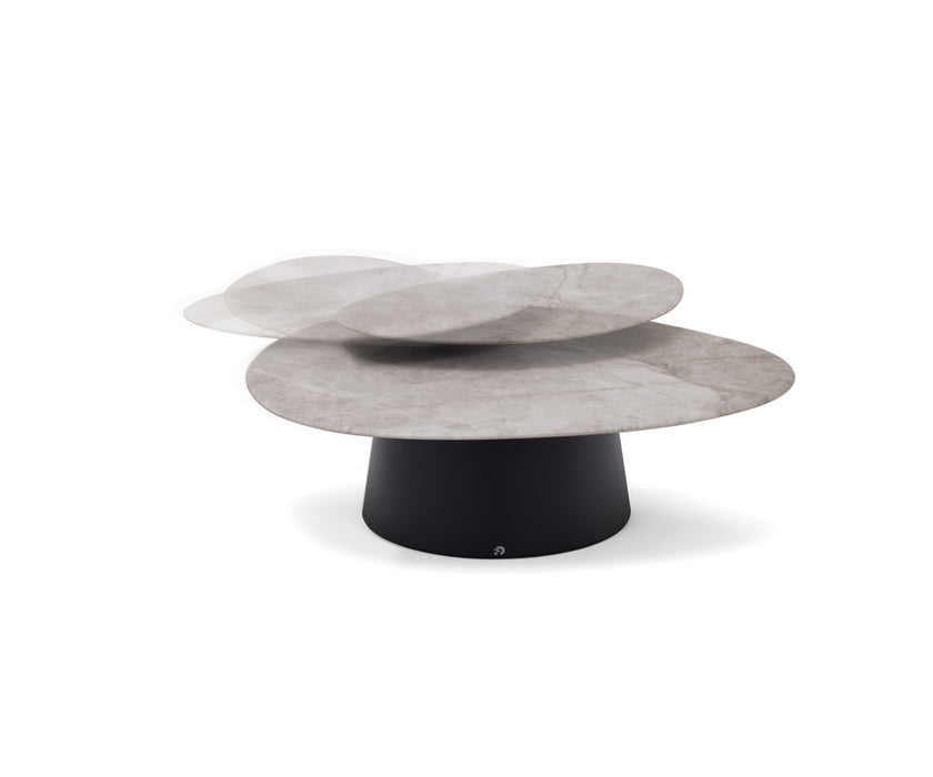 Move Coffee Table by Draenert with rotating natural stone tops and a conical metal base.