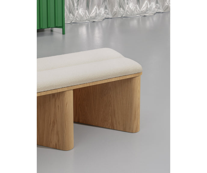Nami Bench by Miniforms with a sculptural bent wood base and contemporary design.