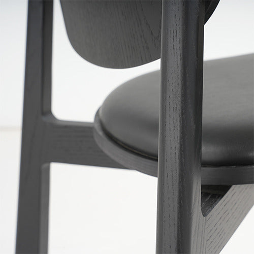 Naqi Dining Chair with solid wood frame and interchangeable upholstered seat by Skram | Casa Design Group