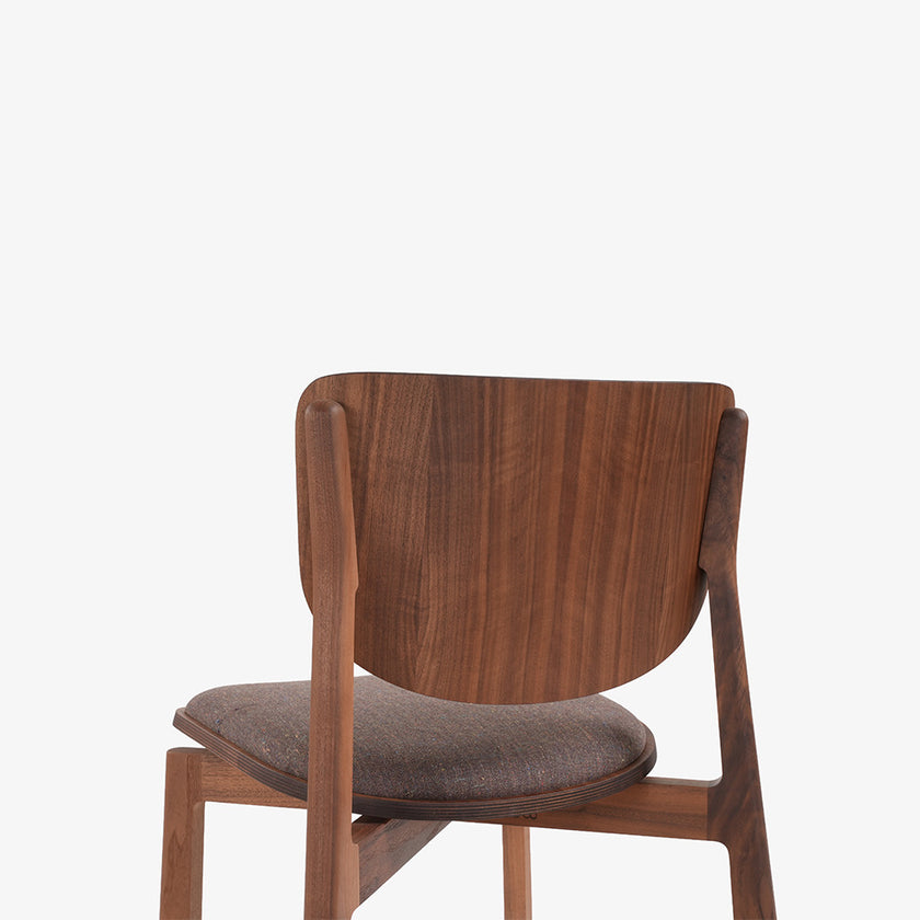 Naqi Dining Chair with solid wood frame and interchangeable upholstered seat by Skram | Casa Design Group