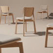 Naqi Dining Chair with solid wood frame and interchangeable upholstered seat by Skram | Casa Design Group