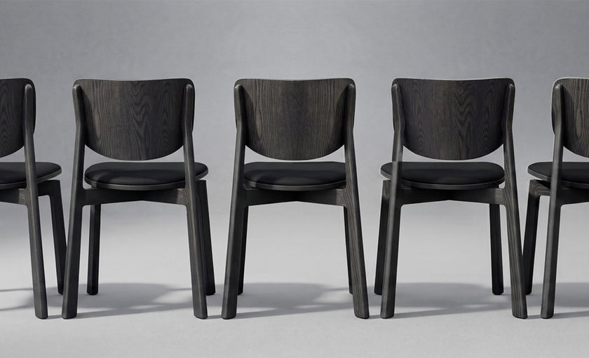 Naqi Dining Chair with solid wood frame and interchangeable upholstered seat by Skram | Casa Design Group