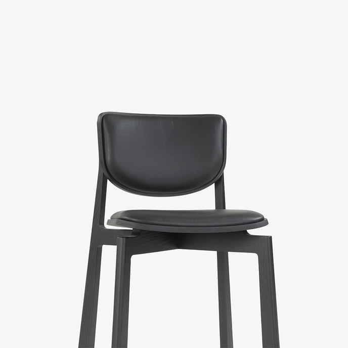 Naqi Dining Chair with solid wood frame and interchangeable upholstered seat by Skram | Casa Design Group