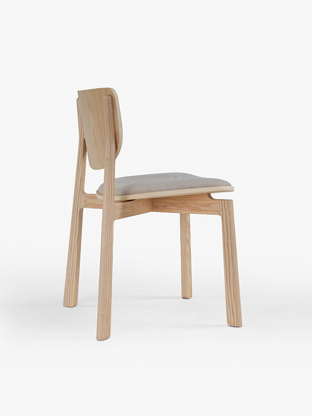 Naqi Dining Chair with solid wood frame and interchangeable upholstered seat by Skram | Casa Design Group