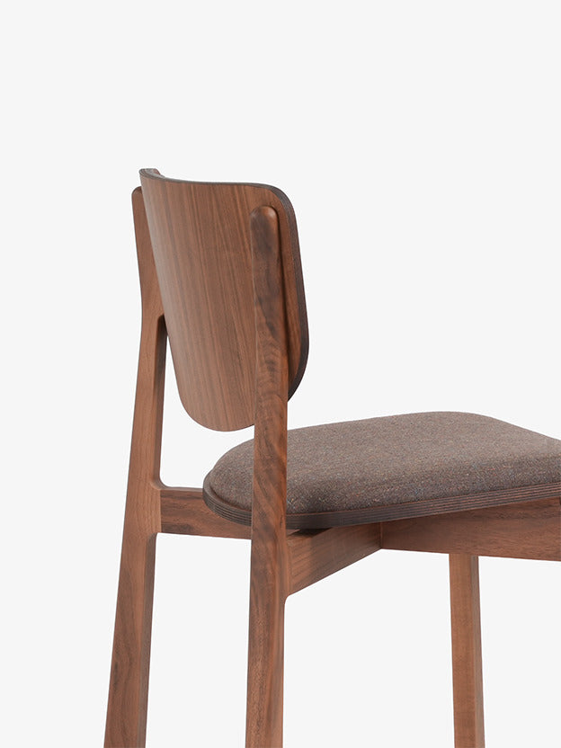 Naqi Dining Chair with solid wood frame and interchangeable upholstered seat by Skram | Casa Design Group