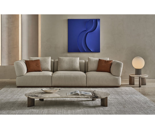 Noah organic coffee table by Rugiano with a sculptural stone top and minimalist base.