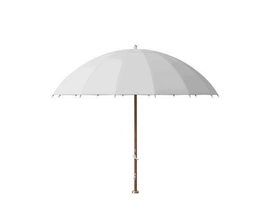 Modern outdoor Bolero parasol by Tuuci featuring curved ribs and titanium mast – Casa Design Group