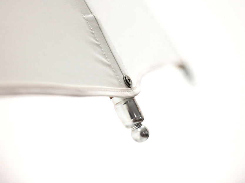 Modern outdoor Bolero parasol by Tuuci featuring curved ribs and titanium mast – Casa Design Group