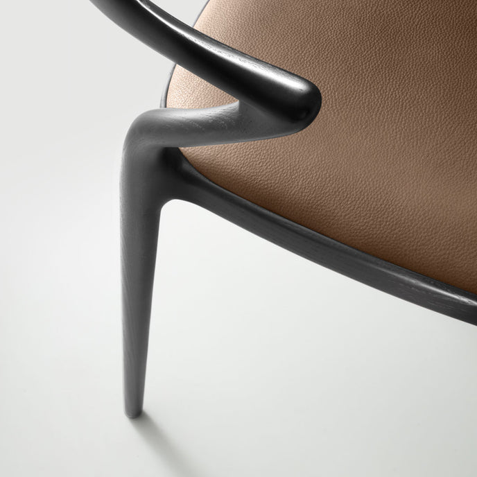 Ori Dining Chair with curved solid wood backrest, integrated armrests and woven cord or upholstered seat by Rimadesio | Casa Design Group