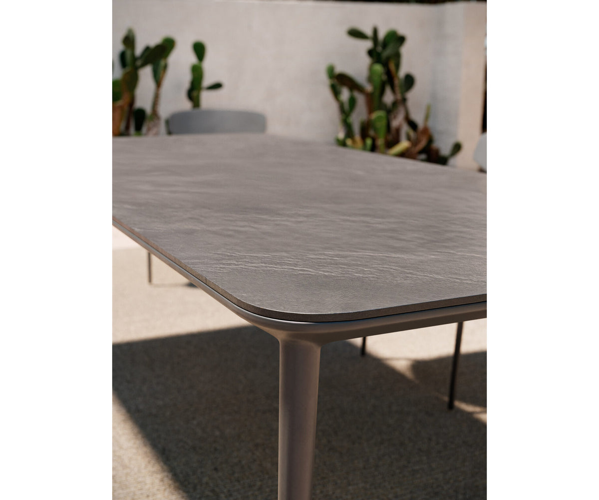Modern Origami Outdoor Dining Table with Gres Top Casa Design Group