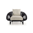 Pan Lounge Chair by Frigerio with handcrafted black reed frame and plush upholstered cushions for luxury interiors.