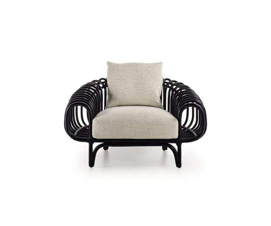 Pan Lounge Chair by Frigerio with handcrafted black reed frame and plush upholstered cushions for luxury interiors.
