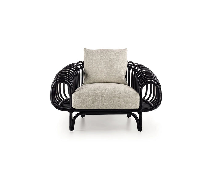 Pan Lounge Chair by Frigerio with handcrafted black reed frame and plush upholstered cushions for luxury interiors.