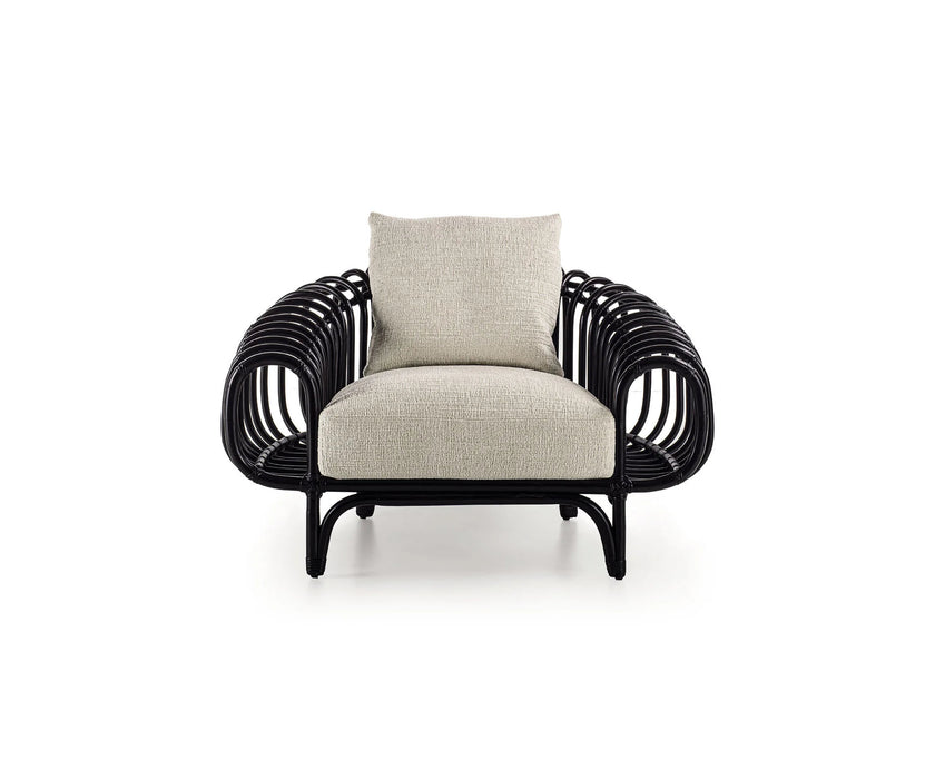 Pan Lounge Chair by Frigerio with handcrafted black reed frame and plush upholstered cushions for luxury interiors.