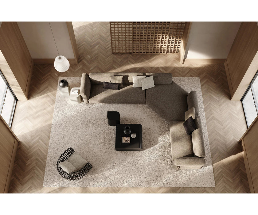 Pan Lounge Chair by Frigerio with handcrafted black reed frame and plush upholstered cushions for luxury interiors.