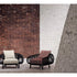 Pan Lounge Chair by Frigerio with handcrafted black reed frame and plush upholstered cushions for luxury interiors.