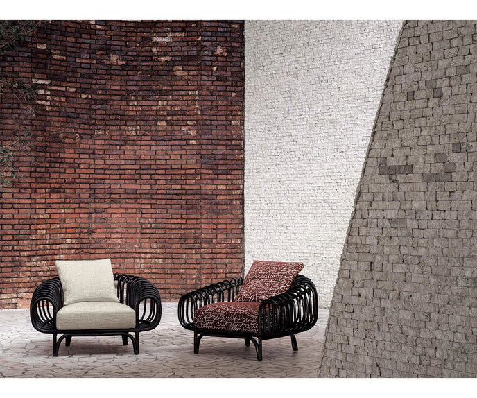 Pan Lounge Chair by Frigerio with handcrafted black reed frame and plush upholstered cushions for luxury interiors.