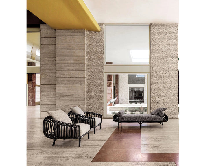 Pan Lounge Chair by Frigerio with handcrafted black reed frame and plush upholstered cushions for luxury interiors.