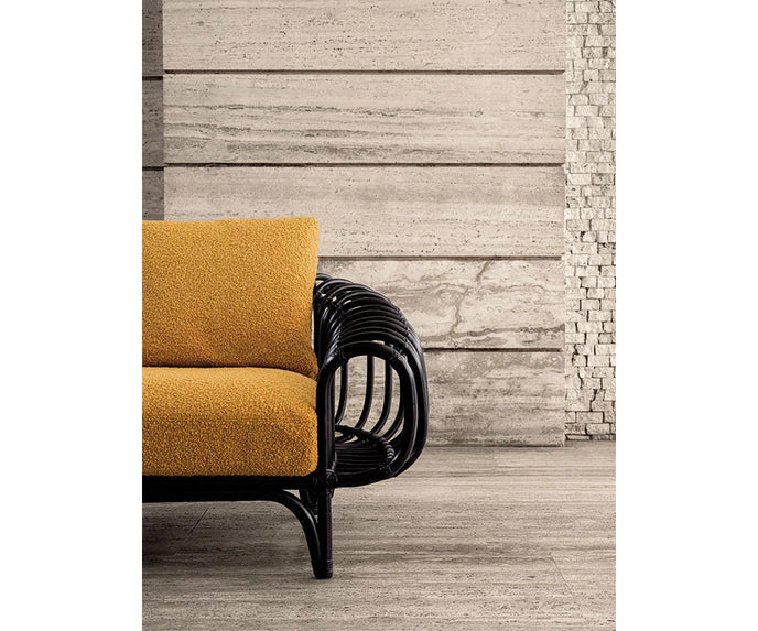 Pan Lounge Chair by Frigerio with handcrafted black reed frame and plush upholstered cushions for luxury interiors.