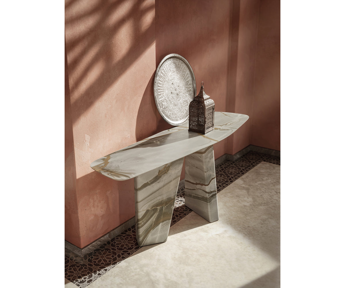 Paramount Console Table by Draenert in natural stone with sculptural monolithic base and organic tabletop design – Casa Design Group