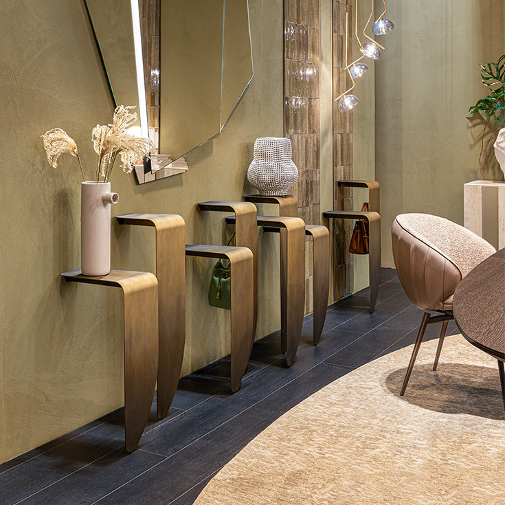 Peninsula Console with sculptural wall-mounted steel elements and distinctive metallic finishes by Cattelan Italia | Casa Design Group