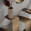 Peninsula Console with sculptural wall-mounted steel elements and distinctive metallic finishes by Cattelan Italia | Casa Design Group