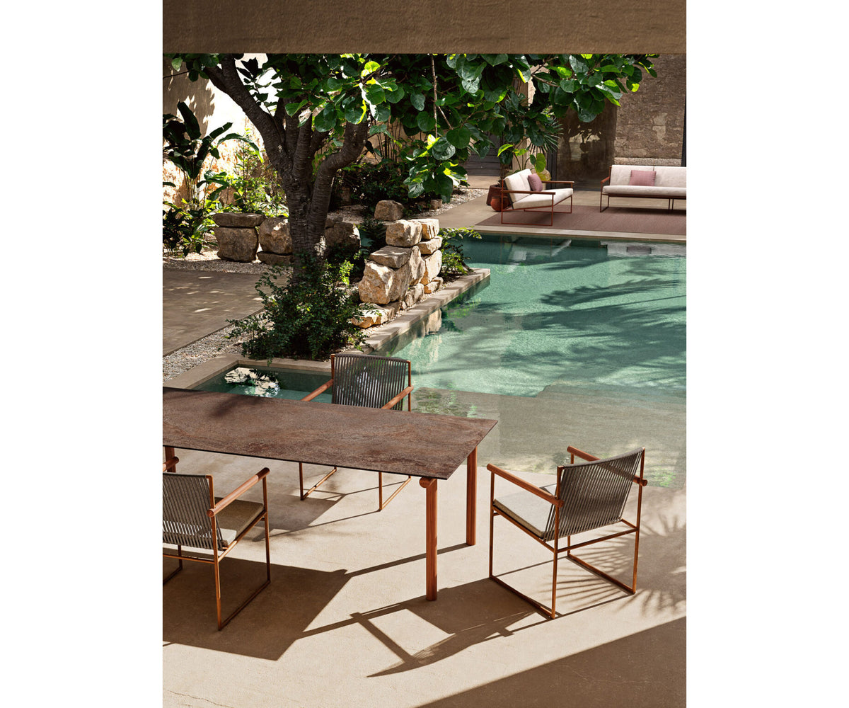 Modern Pipe Outdoor Dining Table with Gres Top Casa Design Group