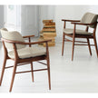 Porada Nissa dining armchair with a solid Canaletta walnut frame and fabric or leather upholstery | Casa Design Group