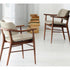 Porada Nissa dining armchair with a solid Canaletta walnut frame and fabric or leather upholstery | Casa Design Group