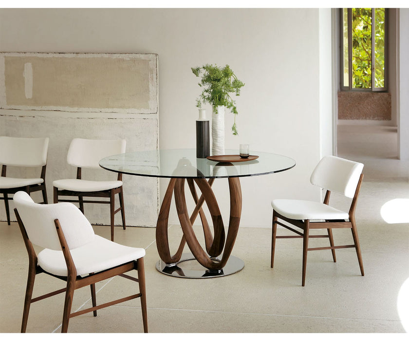 Porada Nissa Side Chair with a solid Canaletta walnut frame and fabric or leather upholstery | Casa Design Group