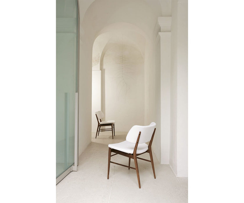 Porada Nissa Side Chair with a solid Canaletta walnut frame and fabric or leather upholstery | Casa Design Group