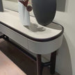 Rami floor sample console by Porada in Wengé-stained Canaletta walnut with leather details | Casa Design Group