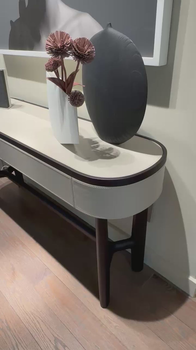 Rami floor sample console by Porada in Wengé-stained Canaletta walnut with leather details | Casa Design Group