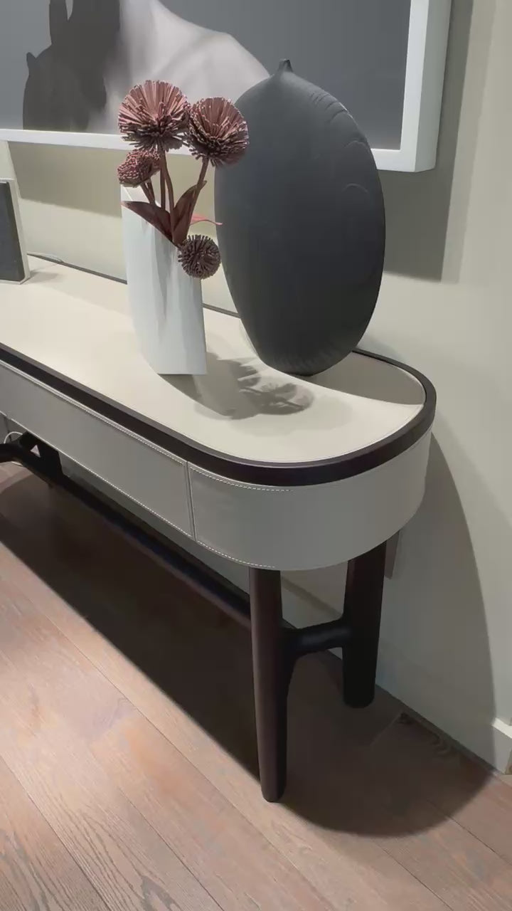Rami floor sample console by Porada in Wengé-stained Canaletta walnut with leather details | Casa Design Group