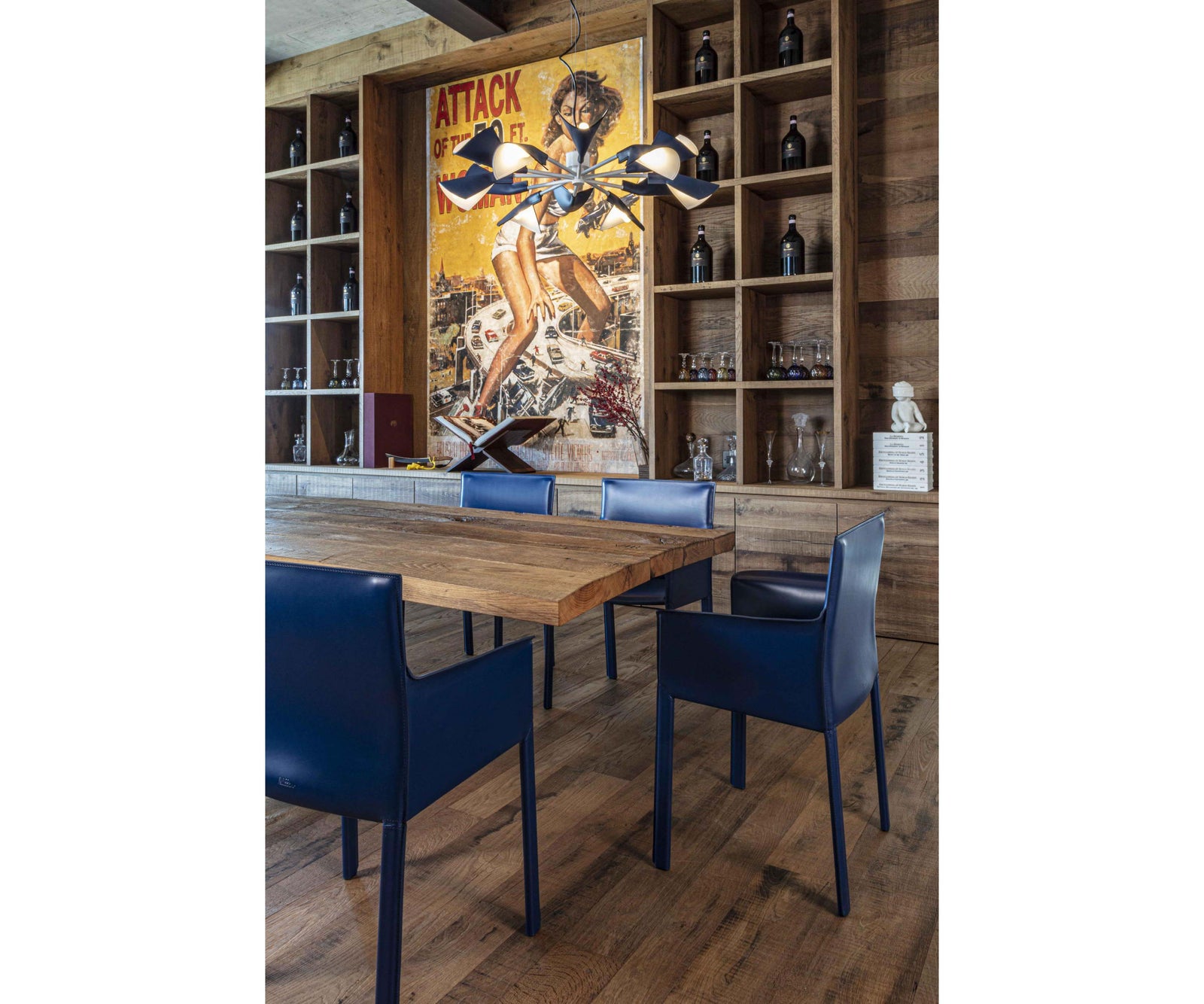 Qualina dining armchair by Enrico Pellizzoni upholstered in leather with contemporary design – Casa Design Group