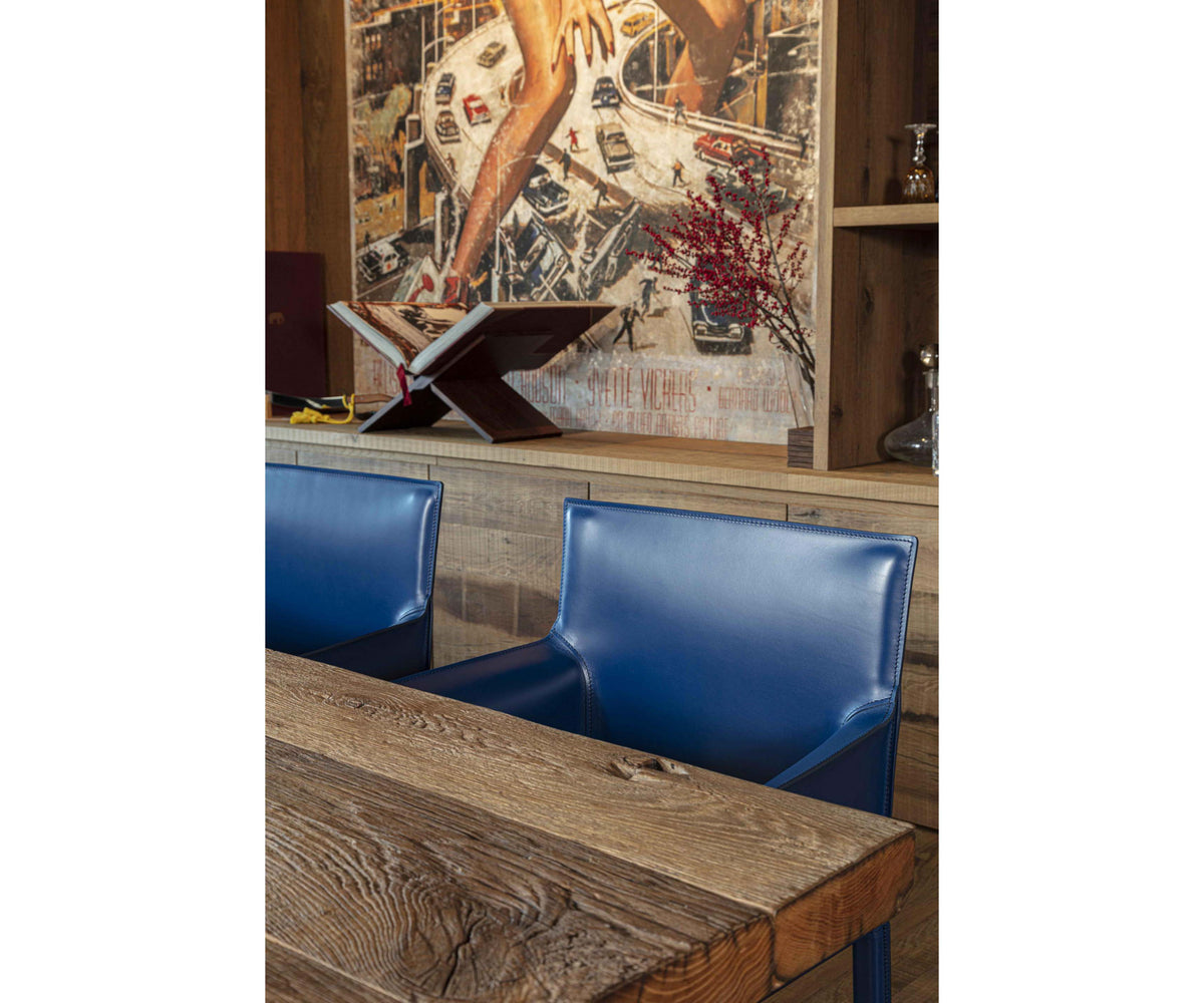 Qualina dining armchair by Enrico Pellizzoni upholstered in leather with contemporary design – Casa Design Group