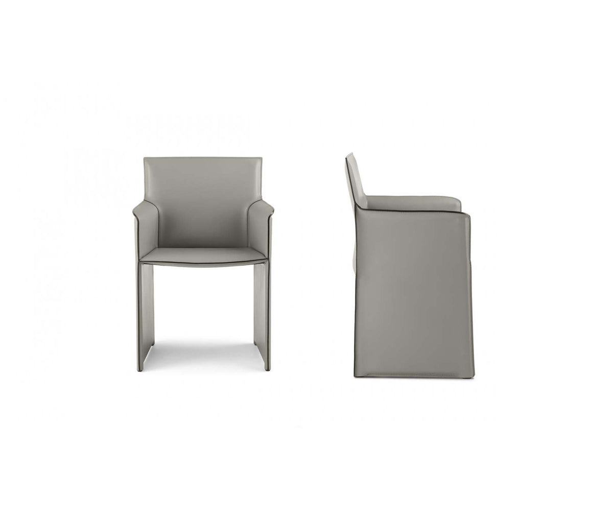 Qualina dining armchair by Enrico Pellizzoni upholstered in leather with contemporary design – Casa Design Group