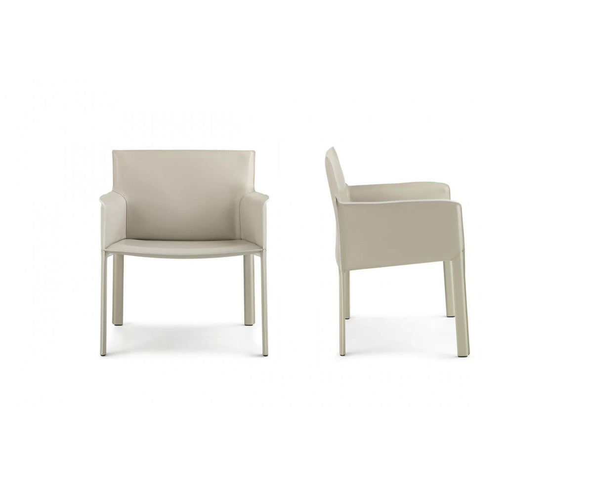 Qualina dining armchair by Enrico Pellizzoni upholstered in leather with contemporary design – Casa Design Group