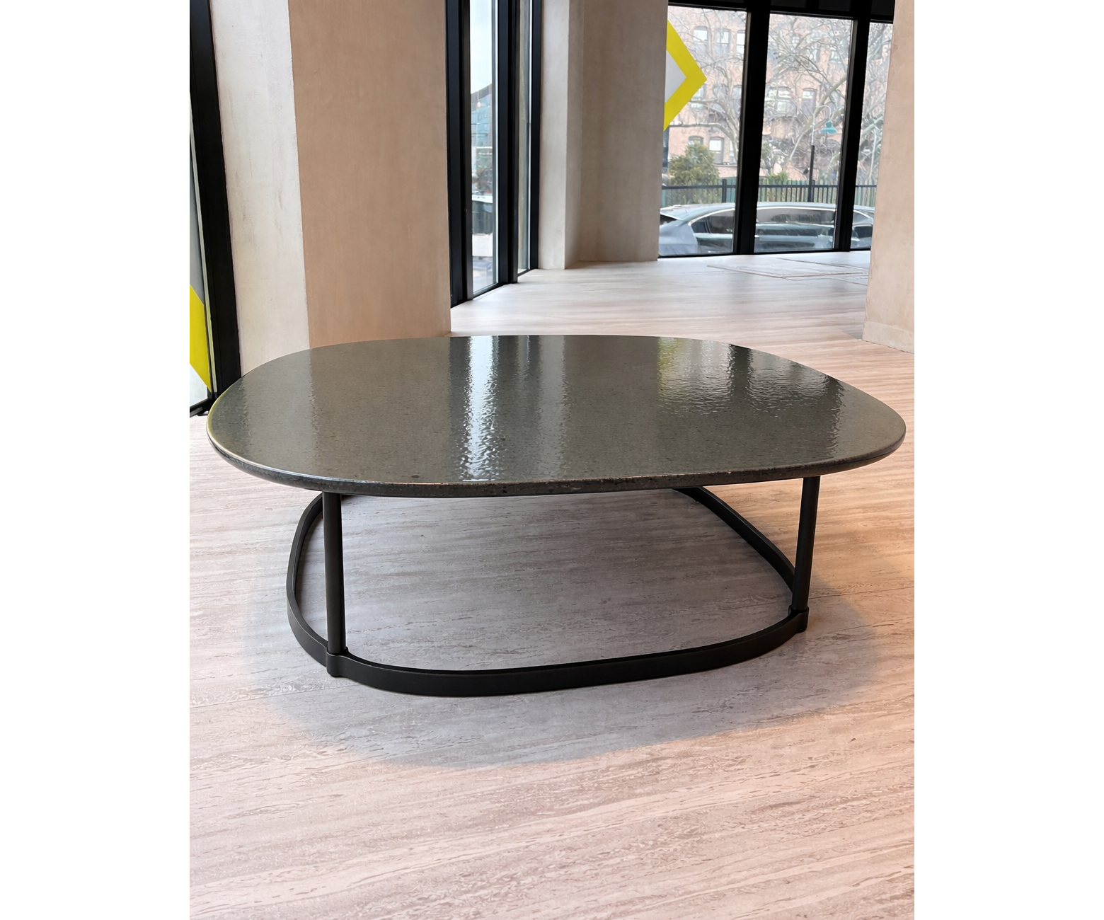 Regent Coffee Table RTQ09 by Molteni&C designed by Vincent Van Duysen with burnished metal base and lava stone top Casa Design Group