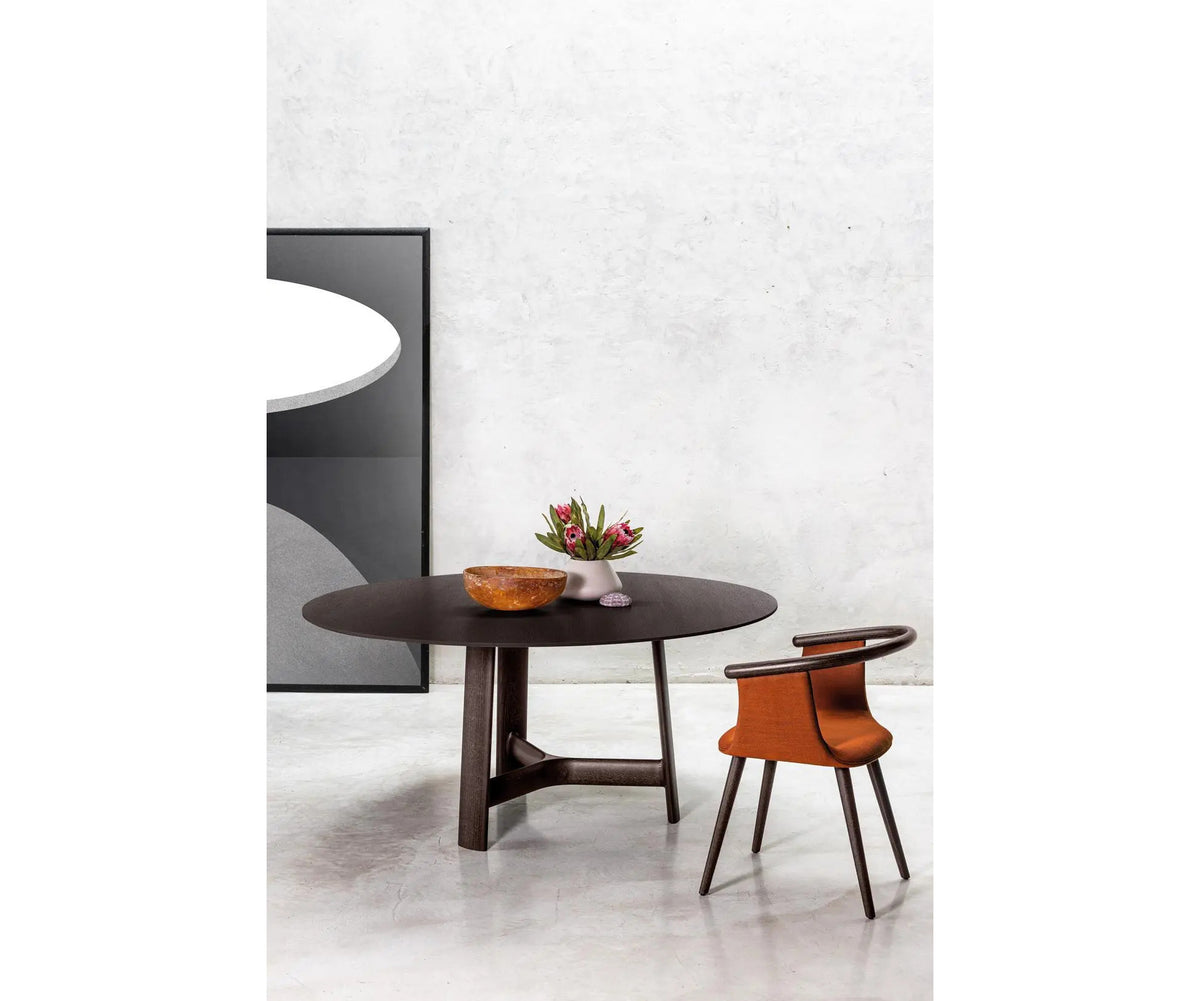 River 3351 dining table by Bross with solid wood base and round top in wood glass or marble Casa Design Group