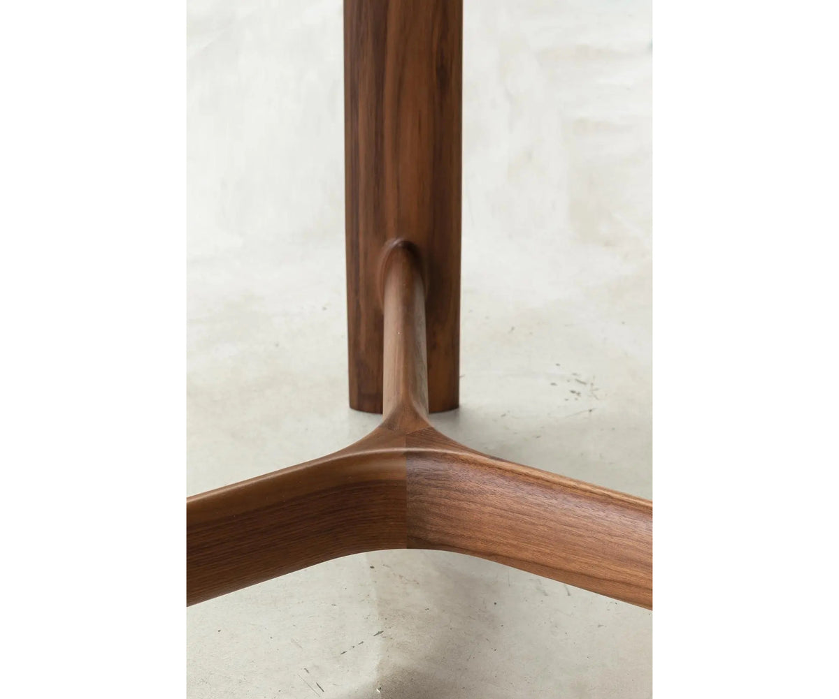River 3351 dining table by Bross with solid wood base and round top in wood glass or marble Casa Design Group