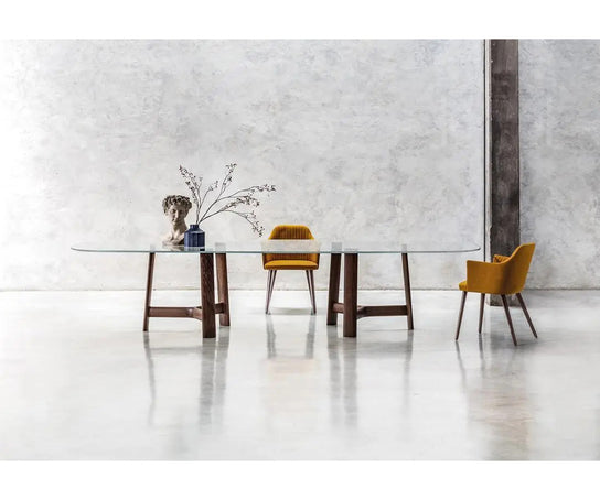 River 3355 table by Bross with solid wood base and oval top in wood glass or marble Casa Design Group