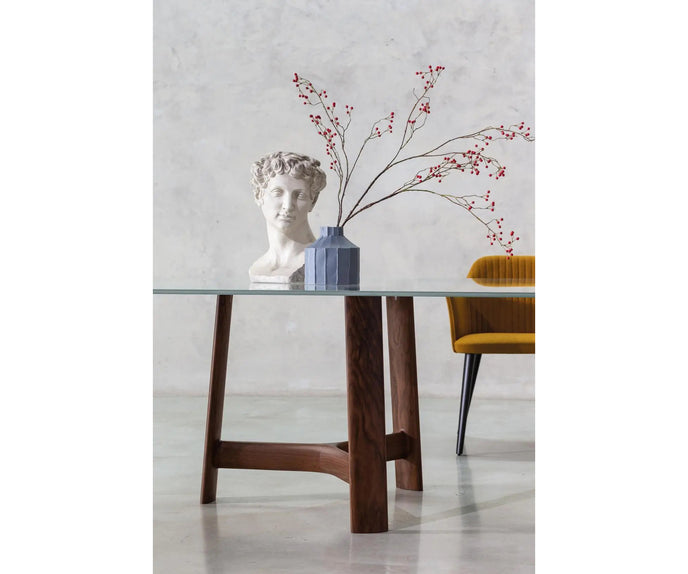 River 3355 table by Bross with solid wood base and oval top in wood glass or marble Casa Design Group