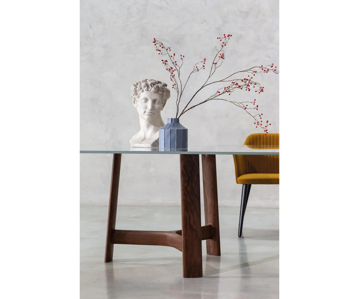 River 3355 table by Bross with solid wood base and oval top in wood glass or marble Casa Design Group