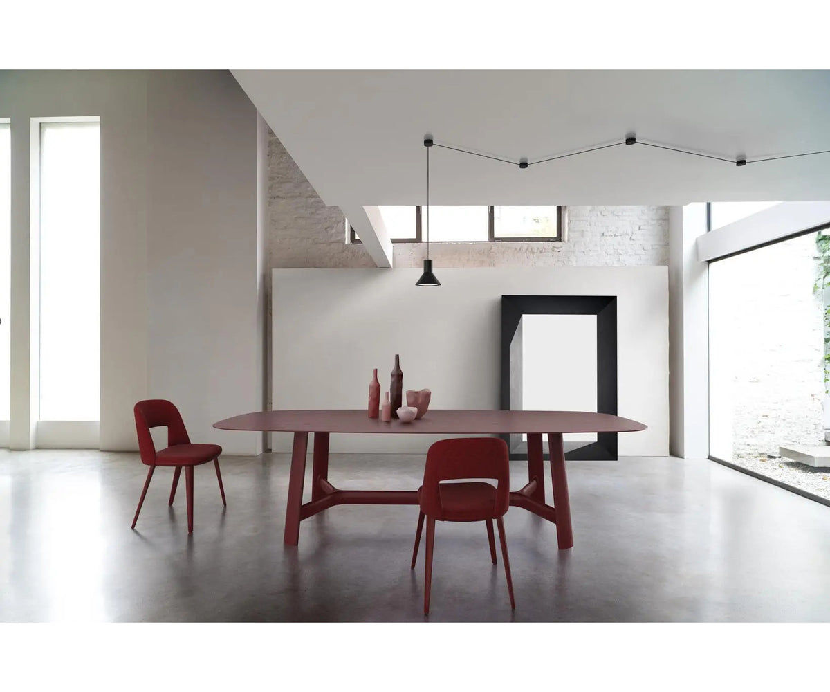 River 3358 table by Bross with solid wood base and oval top in wood glass or marble Casa Design Group