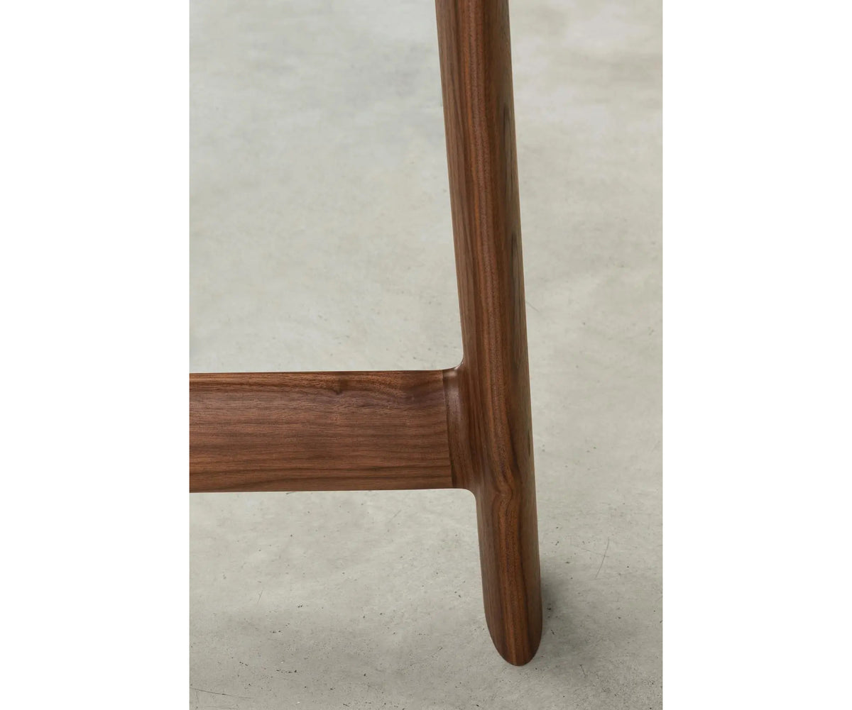 River 3358 table by Bross with solid wood base and oval top in wood glass or marble Casa Design Group
