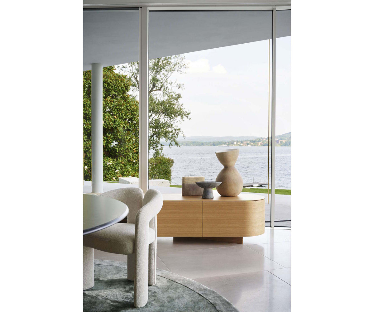 Rondos dresser by Cassina designed by Patricia Urquiola with rounded wooden structure and marble top Casa Design Group