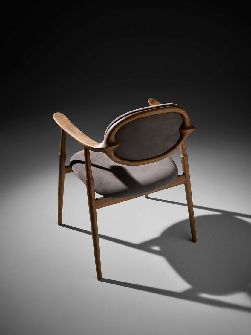 Scapula Dining Chair with sculpted solid wood frame, curved backrest and upholstered seat by Ceccotti Collezioni | Casa Design Group